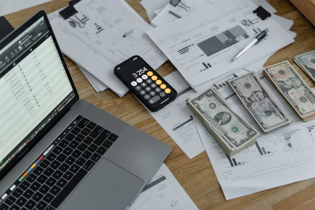 A close-up of banknotes, statements, financial calculations and budgeting activities